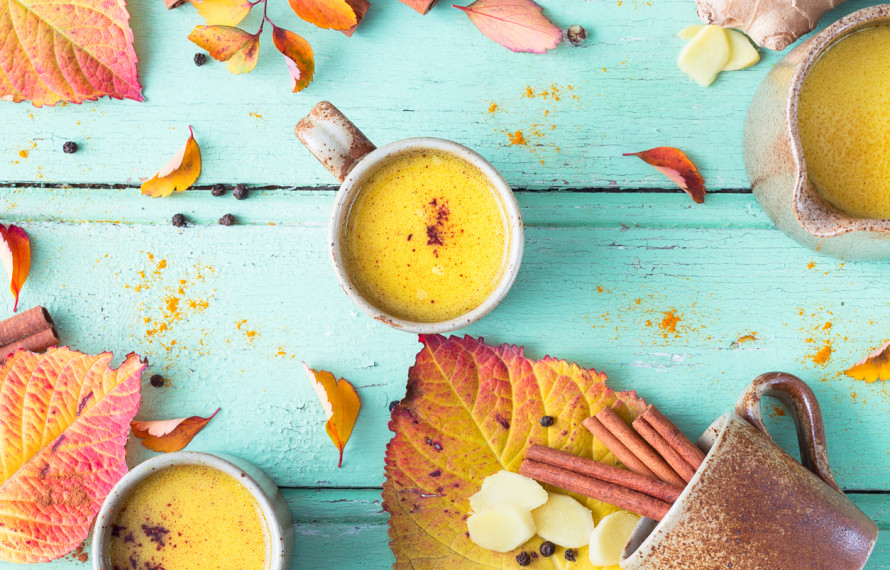 Turmeric golden milk on blue table